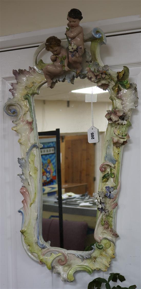 A shaped rectangular pottery wall mirror, H 87cm approx